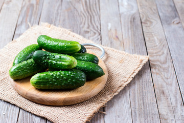 Fresh young cucumbers on a cutting board