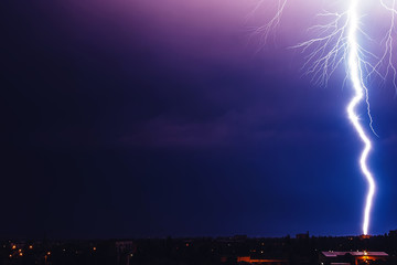 Photo of beautiful powerful lightning over big city, zipper and thunderstorm, abstract background,...