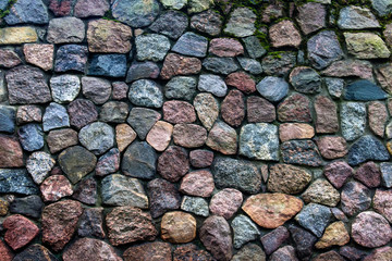 Texture of an ancient stone wall made of separate big stones. Decorative, architectural element.
