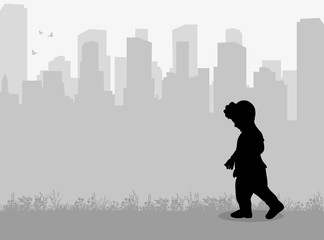 Vector silhouette of a child on a city background