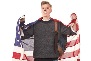 Portrait of male university student with American flag over his shoulders