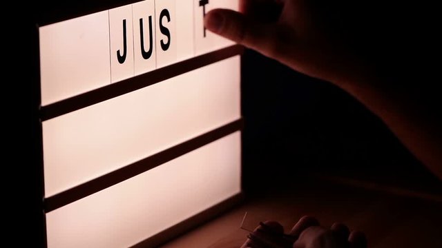 Just keep trying, motivational message on lightbox