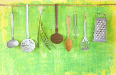 various kitchen utensils and green onions,, cooking concept, good copy space