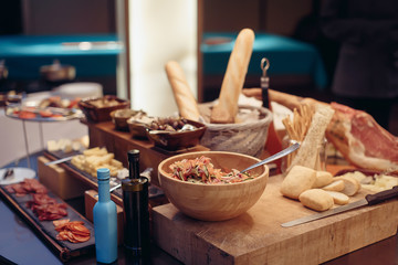 Buffet salad olive bread and jamon