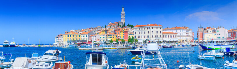 Fototapeta premium Wonderful romantic old town at Adriatic sea. Boats and yachts in harbor at magical summer. Rovinj. Istria. Croatia. Europe.