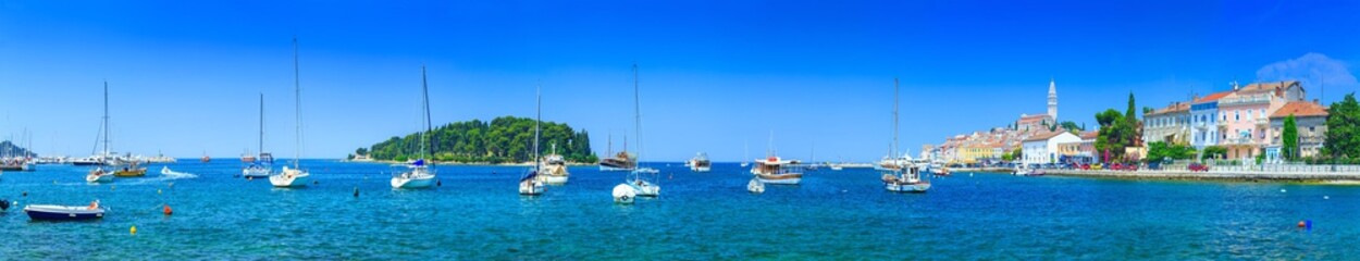 Naklejka na ściany i meble Wonderful romantic old town at Adriatic sea. Boats and yachts in harbor at magical summer. Rovinj. Istria. Croatia. Europe.