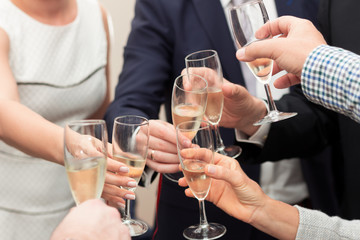 Group of people with elegant clothing celebrating and toasting champagne glasses