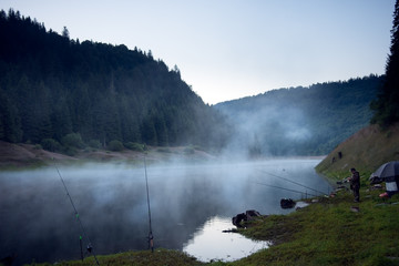 In early morning fishing on the mountain lake