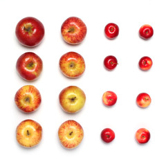 Colorful many red apples fruits in a row isolated on a white background