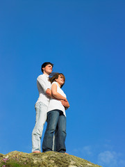 Young couple on a large rock.
