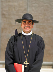 Head and shoulders portrait of priest