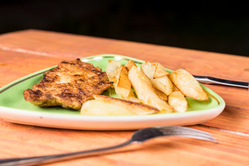 Served lunch with fried chicken breasts in eggs with french fries