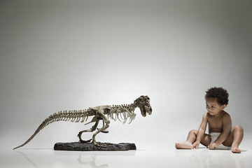 Boy and a dinosaur skeleton