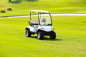 White golf cart in a golf course in the Thailand