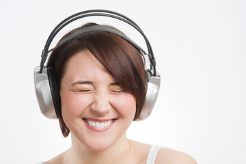 A teenage girl listening to music
