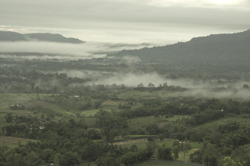 Abstract blurred morning sunset fog and cloud mountain valley landscape