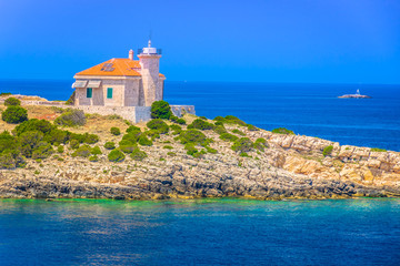 Fototapeta na wymiar Adriatic Sea Vis summer. / Seafront coastline view at croatian islands in Adriatic Sea, Mediterranean summertime. 