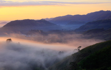 Obraz na płótnie Canvas Sunrise over the mist in the mountains at sunrise over the mountains in Thailand sunrise