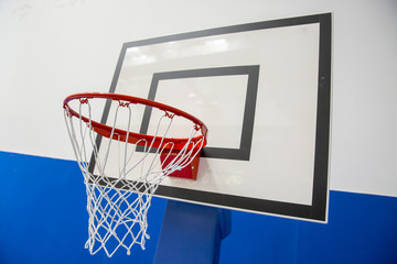 Naklejka premium Basketball hoop in a game hall.