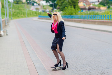 Senior business woman having fun on a skateboard outdoors. The concept of moving forward.