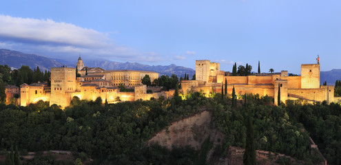 Fototapeta premium Night photo of the Alhambra Palace illuminated, in Granada, Andalusia, Spain. A monument icon, the most visited in Spain