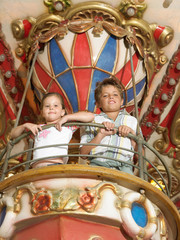 Obraz na płótnie Canvas Brother and sister on a fairground ride