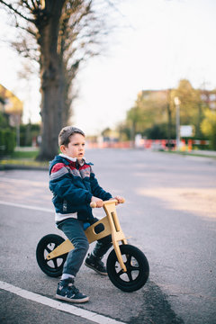Cute Boy Riding His Balance bike