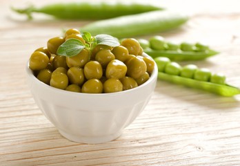 canned peas on wooden background