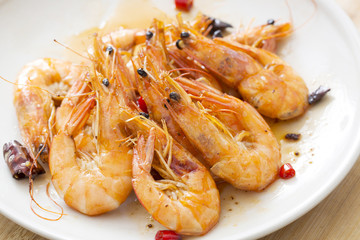 Delicious seafood shrimp closeup on a plate.
