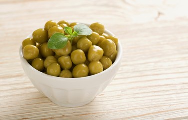 canned peas on wooden background