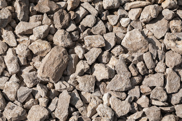 Small stone in the sunlight texture, selective focus