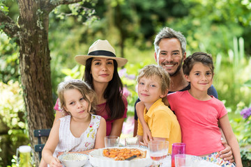 Family portrait around a picnic table
