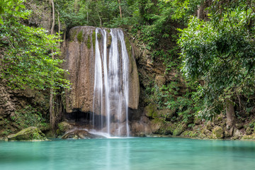 Fototapeta na wymiar Erawan waterfall in deep forest at Erawan National Park, Kanchanaburi, Thailand.