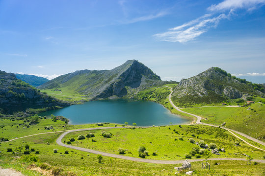 Beautiful nature of Spain: Covadonga mountain lakes in summer sunny day with blue sky and clouds