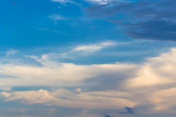 The blue backdrop has some clouds.