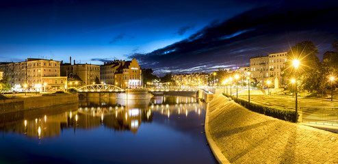 Evening photo of river and buildings of Ostrów Tumski Wroclaw, Poland