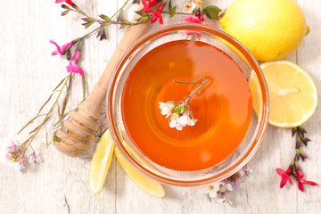 bowl of honey and flowers