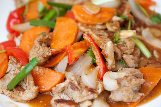 Hot salad with carrot, beef and pepper. Asian cuisine