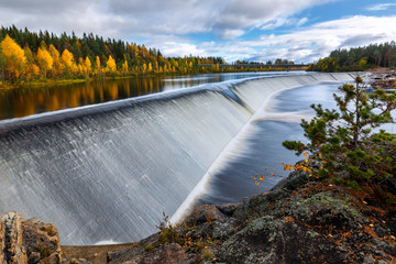 Autumn landscape with river dam and forest, Finland, Lapland, Kemijoki