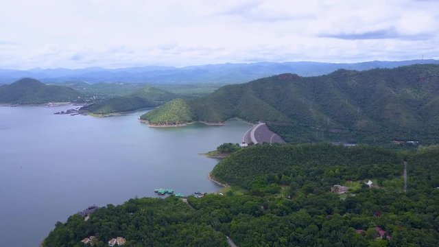 Aerial shot with from a drone of Srinagarind Dam in Kanchanaburi Thailand. It is used for river regulation and hydroelectric power generation.
