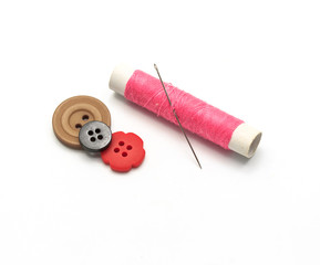 Needle thread and.studs on white