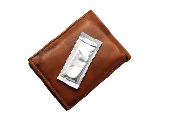One condom in brown leather wallet on white