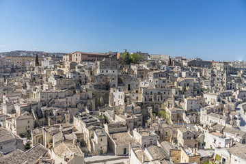 Obraz premium amazing panorama view of ancient ghost town of Matera (Sassi di Matera) in bright sun shine summer with blue sky, south Italy