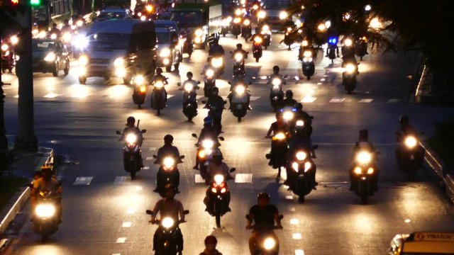 HO CHI MINH, VIETNAM - MARCH 18 2017: Rush hour, traffic sound. Thousands of motorcycles and car crowd the streets of Ho Chi Minh City also known as Saigon, the largest city in Vietnam