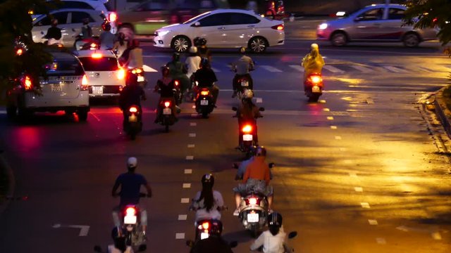 HO CHI MINH, VIETNAM - MARCH 18 2017: Rush hour, traffic sound. Thousands of motorcycles and car crowd the streets of Ho Chi Minh City also known as Saigon, the largest city in Vietnam