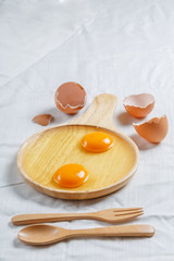 york egg in wood plate