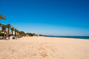 Fototapeta na wymiar Sandy beach in L'Hospitalet de l'Infant, Tarragona, Catalunya, Spain. Copy space for text.