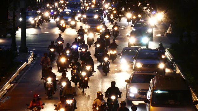 HO CHI MINH, VIETNAM - MARCH 18 2017: Rush hour, traffic sound. Thousands of motorcycles and car crowd the streets of Ho Chi Minh City also known as Saigon, the largest city in Vietnam
