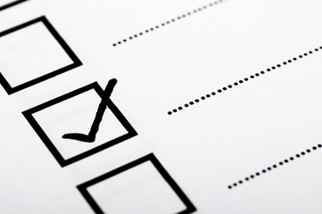 Checklist concept - checklist box with black checkmark and paper.