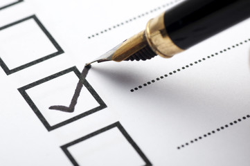 Checklist concept - checklist box with black checkmark and paper.